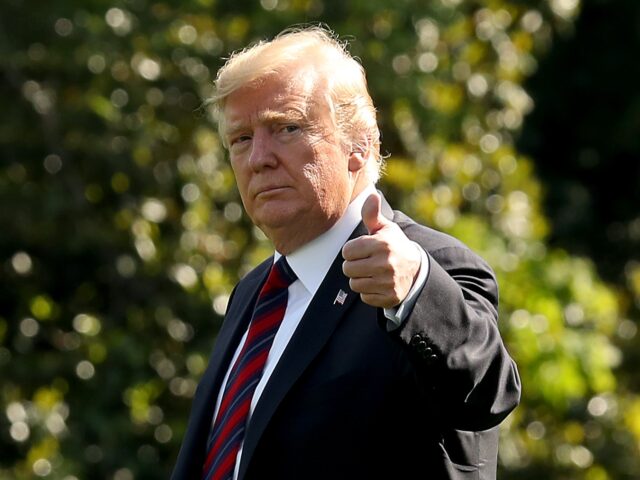 WASHINGTON, DC - MAY 16: U.S. President Donald Trump gives a thumbs up as he walks toward
