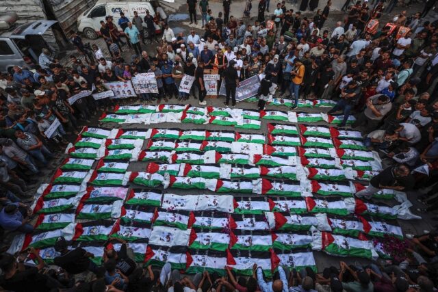 A mass burial for Palestinians, including 62 children, whose remains were recovered from r
