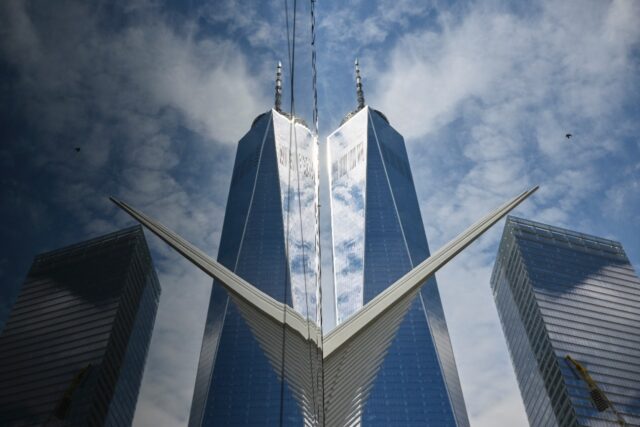 A new skyscraper, One World Trade Center, rises from the New York location of the Twin Tow