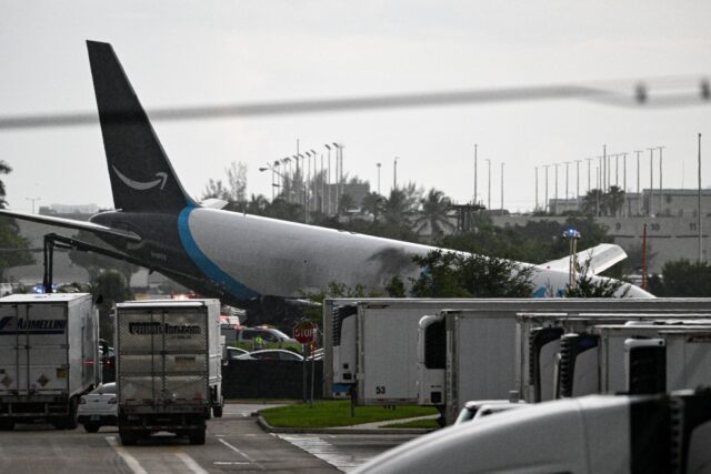 The tail section of a cargo plane is seen at Miami International Airport after it overshot