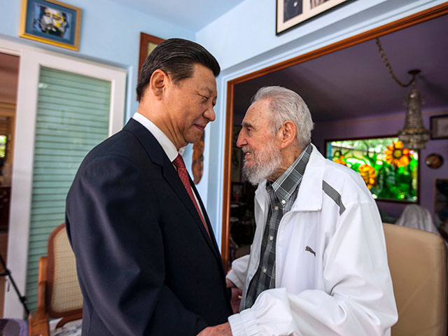 Title: China Cuba Castro Image ID: 16331265547419 Article: FILE - In this July 22, 2014 file photo, Cuba's former President Fidel Castro, right, greets China's President Xi Jinping in Havana, Cuba. Castro, who led a rebel army to victory in Cuba, embraced Soviet-style communism and defied the power of 10 U.S. presidents during his half century rule, died at age 90 on Friday, Nov 25, 2016. Viewed from the world’s largest communist country, Castro’s death is a reminder of how the communist axis has changed beyond recognition since the ideologically charged era when the bearded revolutionary cut a dashing figure on the world stage alongside leaders like Mao Zedong. (AP Photo/Alex Castro, File)