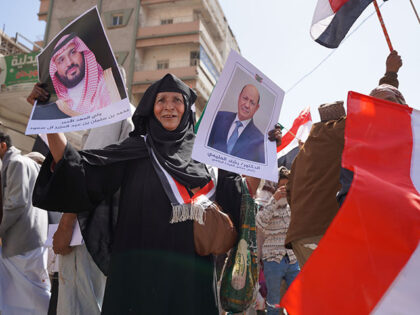 Title: Yemen Iran War Image ID: 26089369350018 Article: A protester holds posters of Rasha