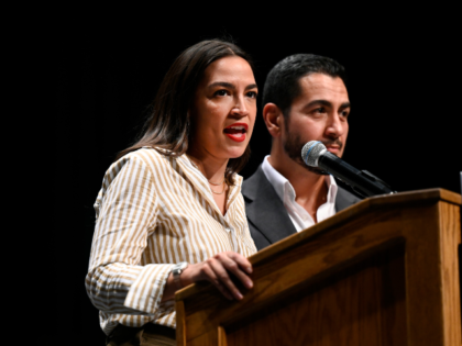 U.S. Rep. Alexandria Ocasio-Cortez, D-N.Y., left, talks about Michigan Democratic U.S. Sen
