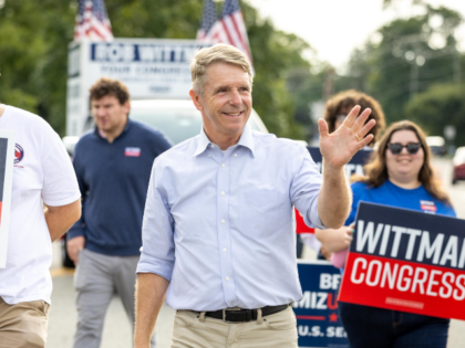 Rep. Rob Wittman, R-Va., waves during the 30th annual Glen Allen Day parade on Saturday, S