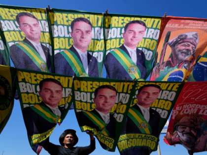 A street vendor sells campaign flags of presidential candidates Sen. Flavio Bolsonaro and