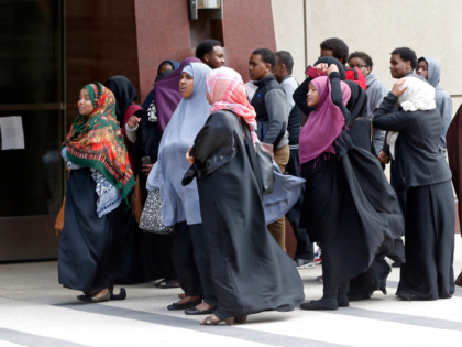 Members of the Minneapolis Somali community wait Tuesday, May 12, 2015, to enter the Unite
