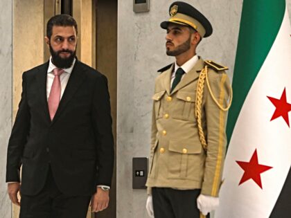 Syria's President Ahmed al-Sharaa (L) arrives to receive UN Secretary-General Antonio Gute