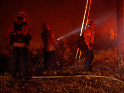 Los Angeles County firefighters monitor the Bryson Fire on October 15, 2026 in Malibu, Cal