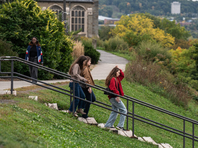 This photo taken on October 2, 2026, shows students walking through campus at Cornell Univ
