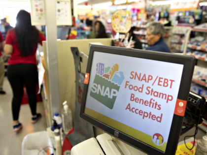 "SNAP/EBT Food Stamp Benefits Accepted" is displayed on a screen inside a Family Dollar St