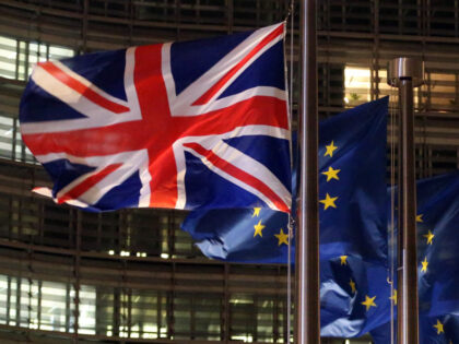 A picture taken on December 9, 2020 shows a flag of the an Union Jack and European flags f