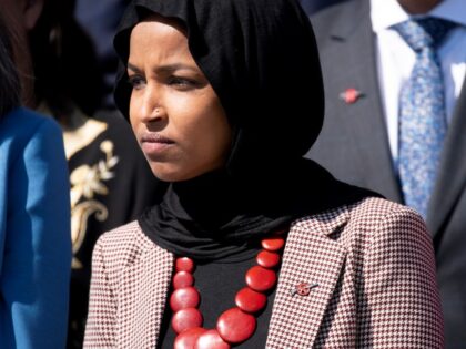 US Representative Ilhan Omar (D-MN) wears an anti-assault rifle pin during a news conferen