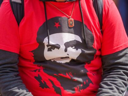 01 May 2024, Hesse, Frankfurt/Main: A man wears a shirt showing the likeness of Marxist re