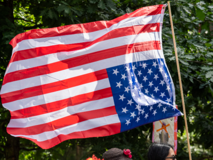 LONDON, UNITED KINGDOM - 2025/06/14: An upside down American flag seen during the demonstr