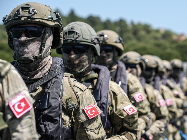 IZMIR, TURKIYE - MAY 12: Turkish soldiers are seen next to the 'Karayel' patrol boats, pro