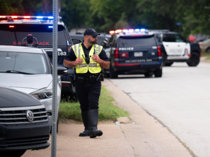 Police at the scene of an incident on West Division street in Arlington, Texas, where Arli