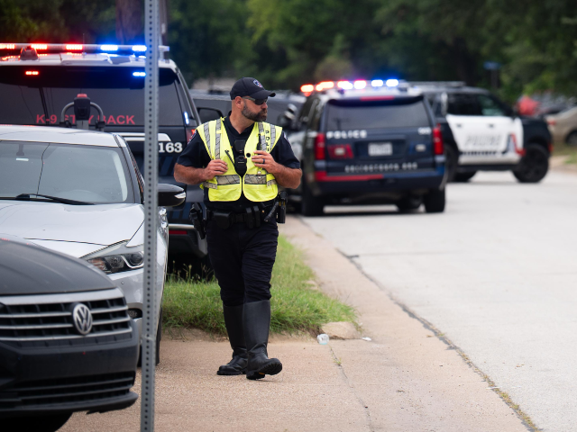 Police at the scene of an incident on West Division street in Arlington, Texas, where Arli