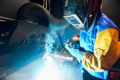 A student practices stick welding during a welding class at the Community College of Phila