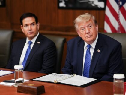 US President Donald Trump, alongside US Secretary of State Marco Rubio (L), speaks during