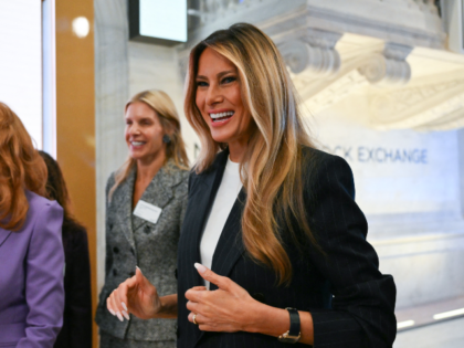 US First Lady Melania Trump walks on the floor of the New York Stock Exchange (NYSE) befor