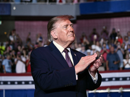 US President Donald Trump arrives to speak during a midterm campaign rally at The Mitchell