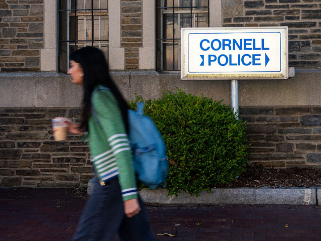  A student walks past Cornell Police headquarters on the C