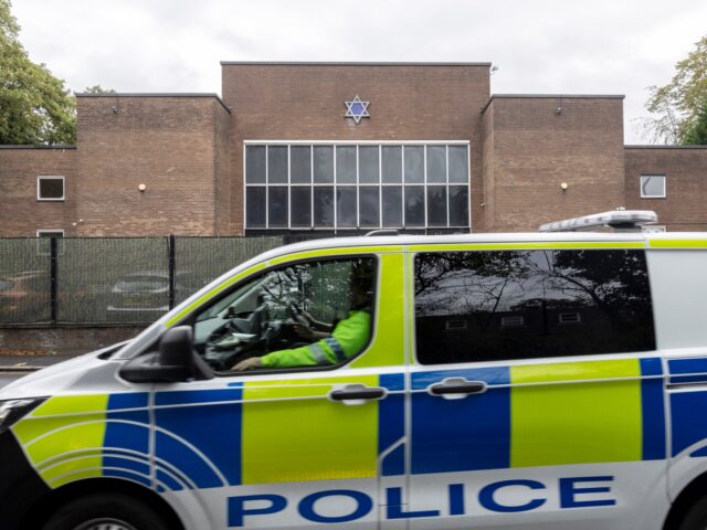 MANCHESTER, ENGLAND - OCTOBER 02: A police car patrols the area around Heaton Park Shul on