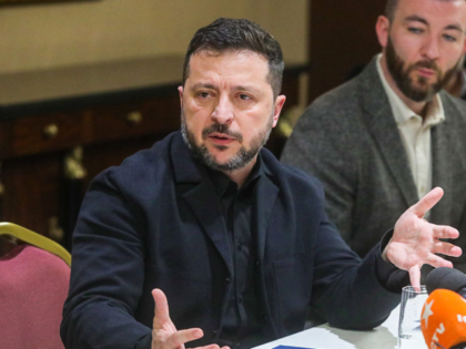 Ukrainian President Volodymyr Zelenskyy (L) speaks to journalists after a meeting with Ger