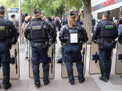 Students gather outside Pitie-Salpetriere Hospital during a protest demanding better educa