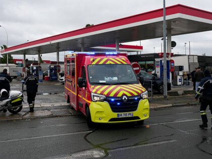 Firefighters intervene on a site of a petrol station where a man opened fire from his car,