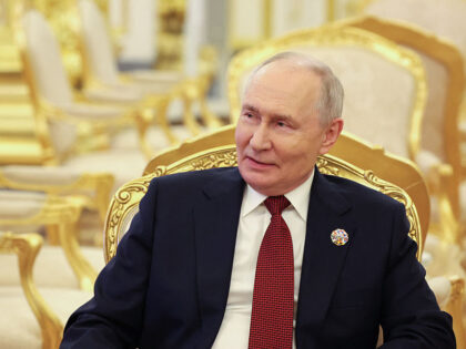 In this pool photograph distributed by the Russian state agency Sputnik, Russia's Pre
