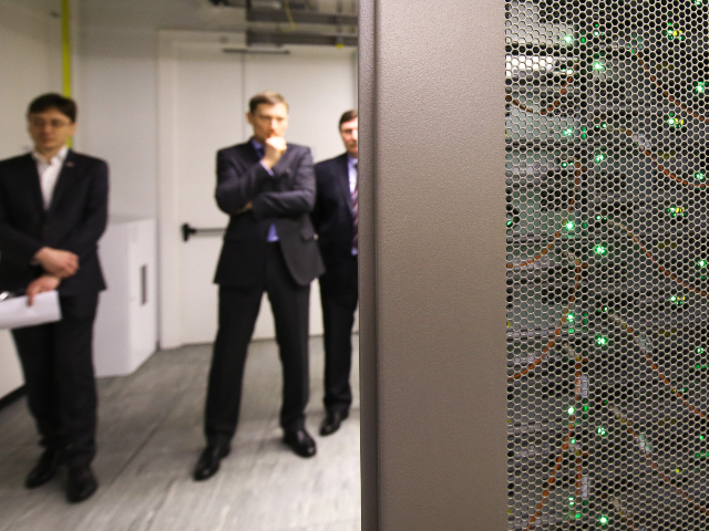 Green lights flash behind a grill of a Terdata Corp. Enterprise Data Warehouse (EDW) serve