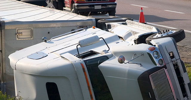 VIDEO: Semi Truck Hauling Hydrochloric Acid Overturns on Illinois Roadway