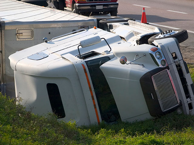 VIDEO: Semi Truck Hauling Hydrochloric Acid Overturns on Illinois Roadway