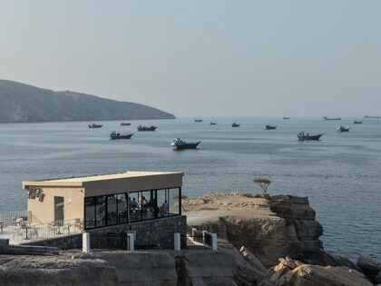 An aerial view shows ships anchored off the coast of Khasab in Oman's Musandam Governorate
