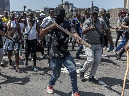 Anti-illegal immigration protestors chant slogans during a march in Durban on October 9, 2
