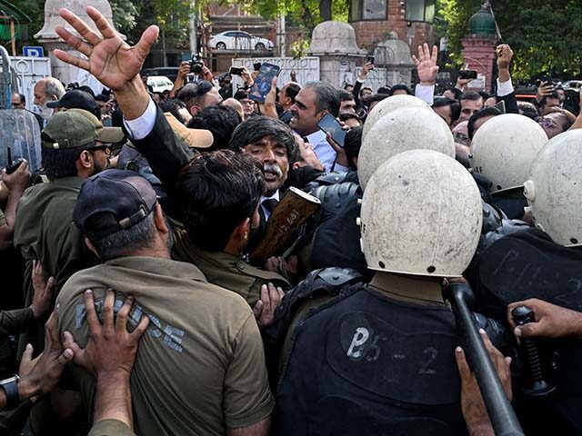 Lawyers scuffle with police during a protest in Lahore on October 12, 2026, condemning the