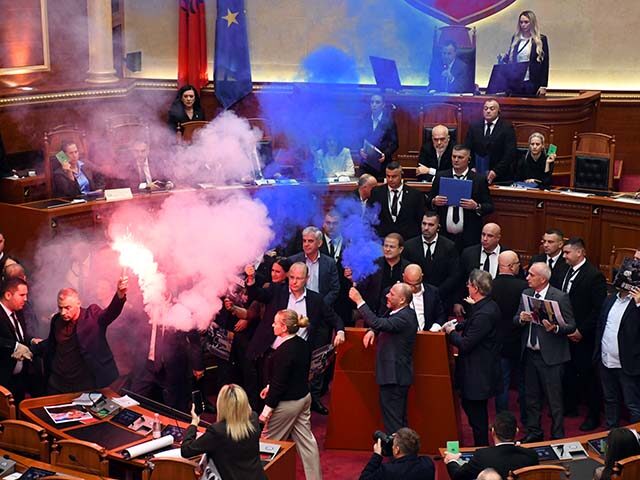 GettyImages2301999284 Opposition lawmakers block the parliamentary podium and set off smoke bombs and flares dur