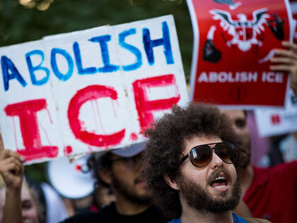 Activists march and rally against Immigration and Customs Enforcement (ICE) and the Trump
