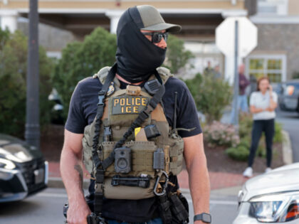 New Bedford, MA - September 22: An ICE agents wears a mask on September 22, 2026. (Photo b
