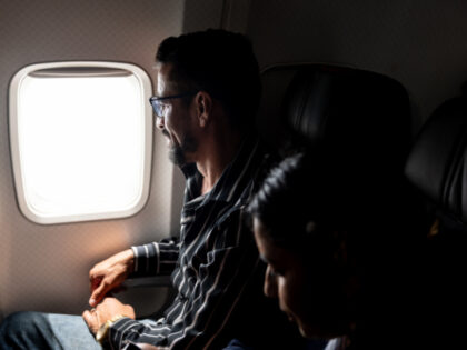 Marvin Suazo, 43, travels on an American Airlines flight while self-deporting on May 25, 2