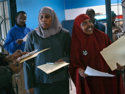 Hodan Hassan and Saciido Shaie, both with the Somali Action Alliance, hand out literature