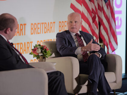 Leidos CEO Tom Bell (r) talks with Breitbart News Washington bureau chief Matthew Boyle at