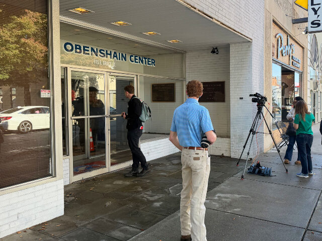 Reporters gather outside the Obenshain Center on Thursday, Oct. 29, 2026, in Richmond, Va.