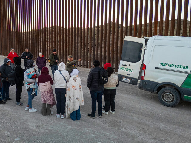default SASABE, ARIZONA - JANUARY 20: Immigrants wait to be transported by U.S. Border Patrol agen