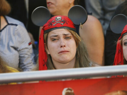 ANAHEIM, CA - MAY 19: A fan cries while attending the premiere of Walt Disney's &quo