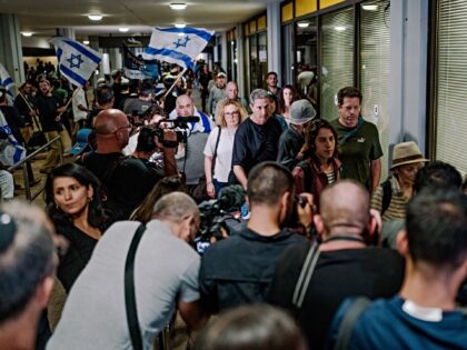 TZAFRIA, ISRAEL - SEPTEMBER 30: A crowd of arriving passengers walks down the terminal cor