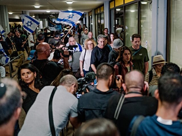 flydubai passengers TZAFRIA, ISRAEL - SEPTEMBER 30: A crowd of arriving passengers walks down the terminal cor
