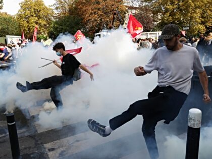 AUBERVILLIERS, FRANCE - OCTOBER 1: Police fire tear gas towards French students during a m