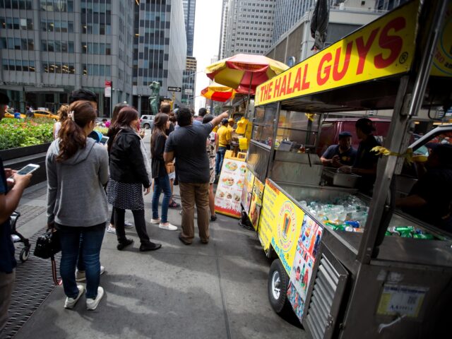halal new york Customers stand in line at The Halal Guys' food cart on West 53rd Street and 6th Avenue in